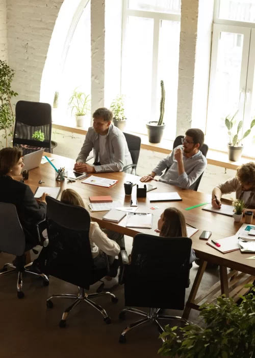 top-view-image-motivated-employees-working-together-office-representing-project-concept-business-min